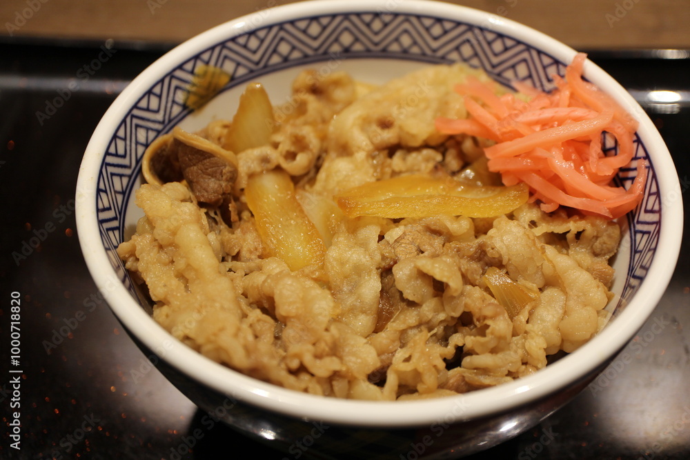 Japanese cuisine: gyudon (beef bowl) with beni shoga (pickled red ginger) in Tokyo, Japan Japanese cuisine: gyudon (beef bowl) with beni shoga (pickled red ginger) in Tokyo, Japan