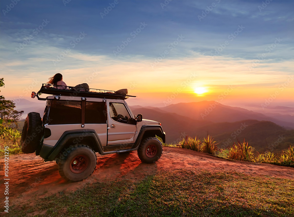 Fototapeta premium adventure off-road vehicle, standing at the sunrise view point along the mountain side