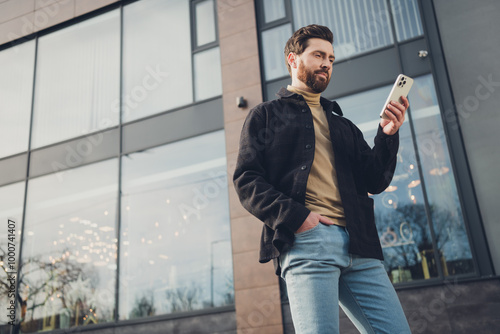 Photo of handsome attractive man wear stylish outfit walk alone city street autumn day outside