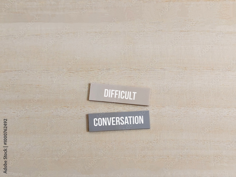 Obraz premium colored paper with the words Difficult Conversation. different of thought. business finance 