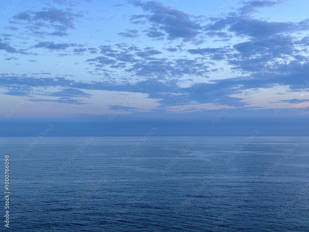 Blue sea and dark clouds in sky at evening. Blue sea and dark clouds in sky at evening.