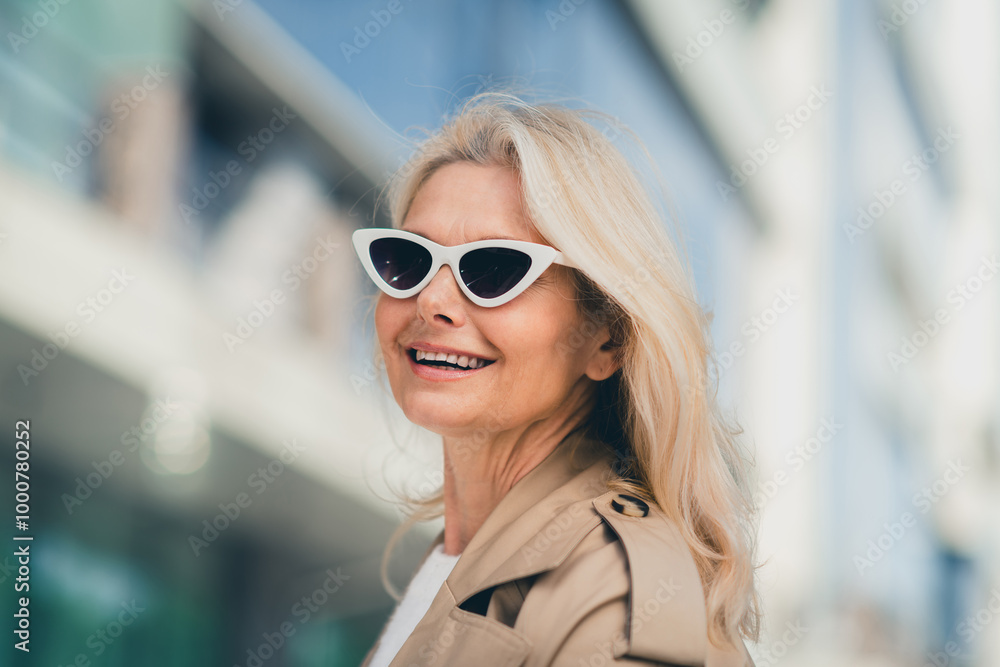 Portrait of cheerful happy retired woman walking smile spring good mood weekend sunglass wear beige coat enjoy outdoors outside park street Portrait of cheerful happy retired woman walking smile spring good mood weekend sunglass wear beige coat enjoy outdoors outside park street