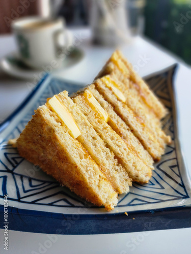 Kaya toasts butter and black coffee is a traditional oriental and vintage Kopitiam breakfast style. Popular in Malaysian and Singaporean photo