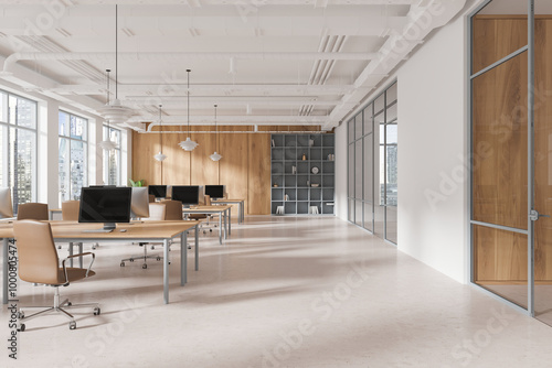 Spacious modern open space office with desks, chairs, computers, and city view through large windows in a loft-style interior. Concept of coworking. 3D Rendering photo