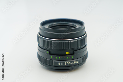 Classic camera lens featuring manual focus, aperture ring, distance scale. For photographers who prioritize control and creativity in image composition, perfect for analog and digital cameras alike