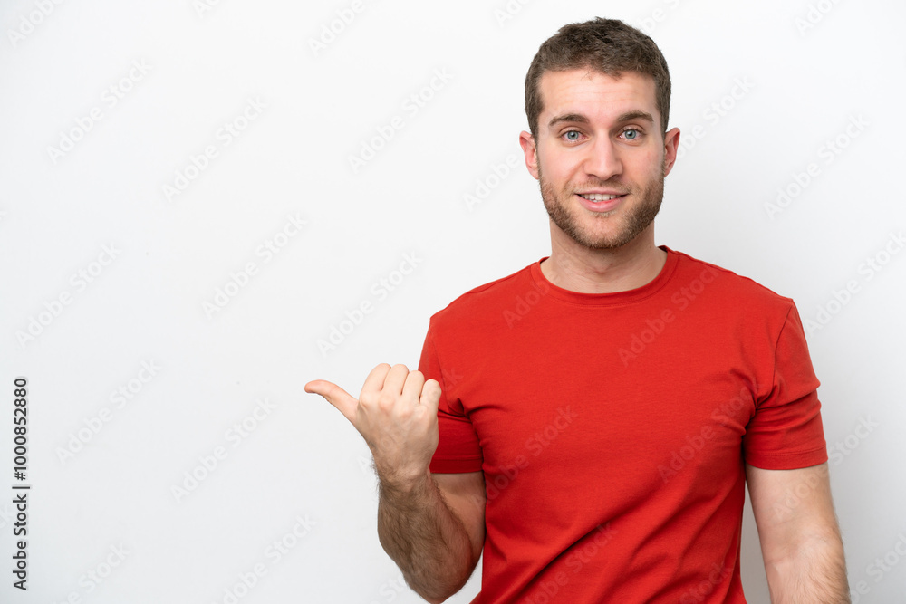 Young caucasian man isolated on white background pointing to the side to present a product Young caucasian man isolated on white background pointing to the side to present a product