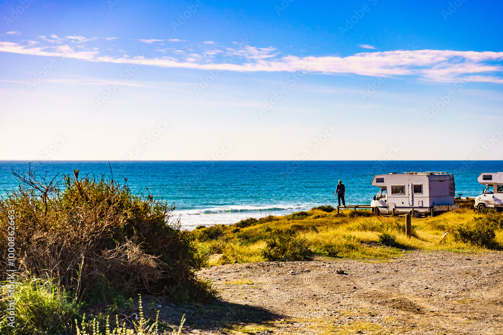 Tourist traveling by camper, camp on seashore, Spain Tourist traveling by camper, camp on seashore, Spain