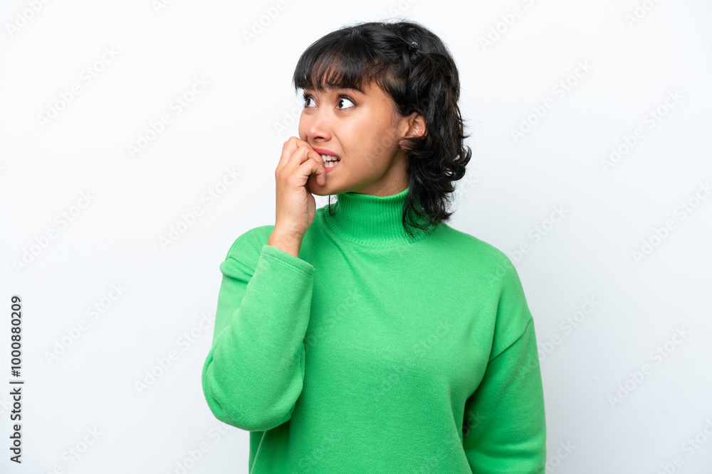 Young Argentinian woman isolated on white background is a little bit nervous Young Argentinian woman isolated on white background is a little bit nervous