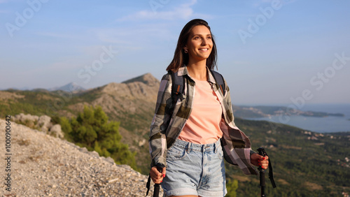 Content young woman exploring the mountain trails