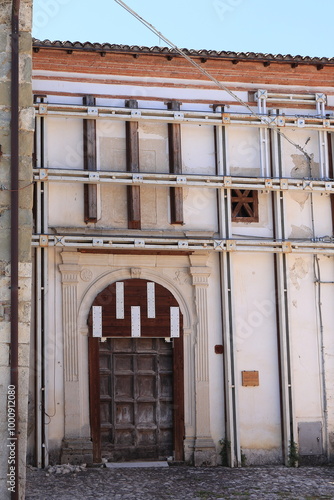 S. Anna Church Facade with Antiseismic Support Structure in Borbona, Italy photo