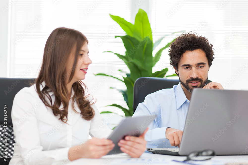 Professional team working together in office Professional team working together in office