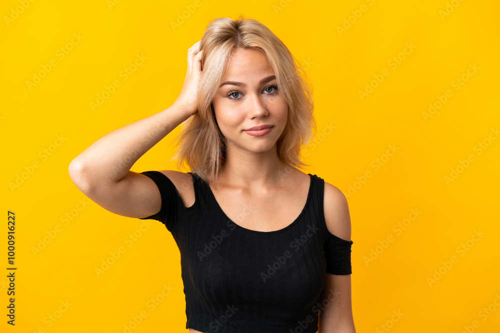 Young Russian woman isolated on yellow background with an expression of frustration and not understanding Young Russian woman isolated on yellow background with an expression of frustration and not understanding