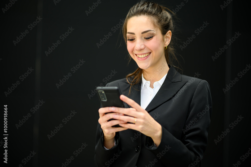 Beautiful young female manager using her smartphone outdoor Beautiful young female manager using her smartphone outdoor