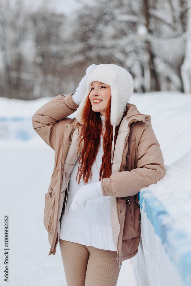 young pretty caucasian redhead smiling girl in white and beige winter clothes skating in ice rink in winter cloudy snowy day, standing and resting young pretty caucasian redhead smiling girl in white and beige winter clothes skating in ice rink in winter cloudy snowy day, standing and resting