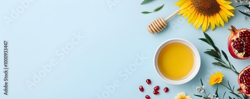 Red pomegranates, apples,  honey, green leaves and flowers on blue background. Traditional symbols of Rosh Hashanah. Jewish New Year holiday. Template for design. Flat lay, top view with copy space photo