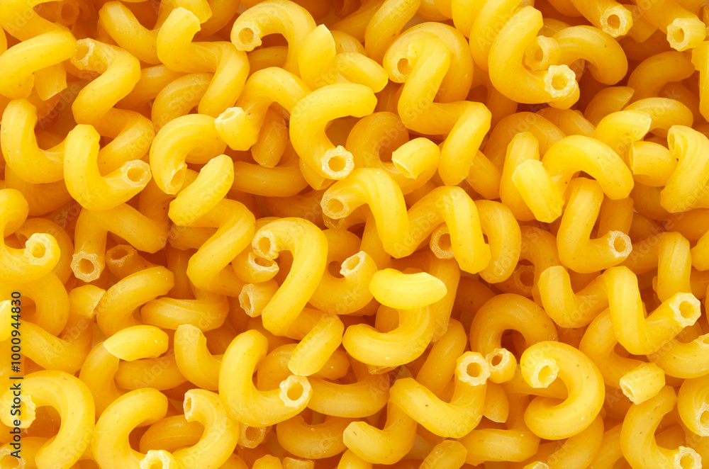 Pile of raw pasta close-up, top view. Italian pasta, texture of pasta cones, top view. Texture of Italian raw pasta. Mediterranean cuisine. Pile of raw pasta close-up, top view. Italian pasta, texture of pasta cones, top view. Texture of Italian raw pasta. Mediterranean cuisine.