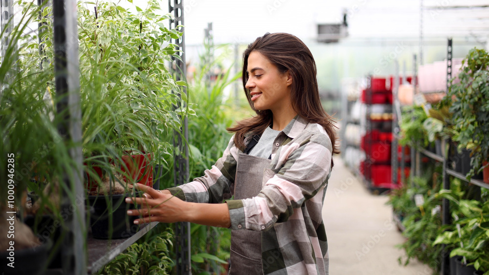 Portrait of a female engineer from the gardening center overseeing gardening process Portrait of a female engineer from the gardening center overseeing gardening process