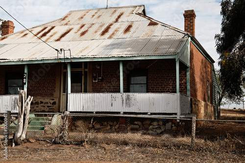 Old rundown house in historical country town photo