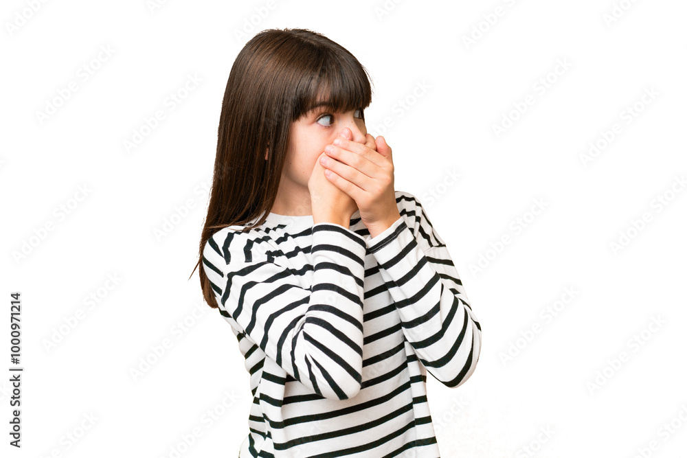 Little caucasian girl over isolated background covering mouth and looking to the side Little caucasian girl over isolated background covering mouth and looking to the side
