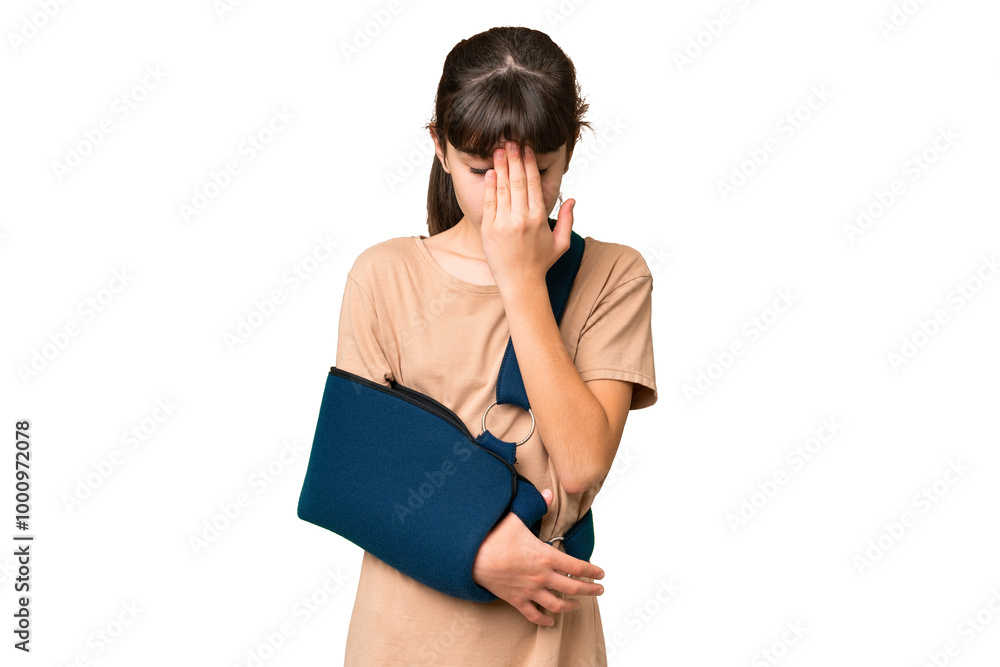 Little caucasian girl with broken arm and wearing a sling over isolated background with tired and sick expression Little caucasian girl with broken arm and wearing a sling over isolated background with tired and sick expression