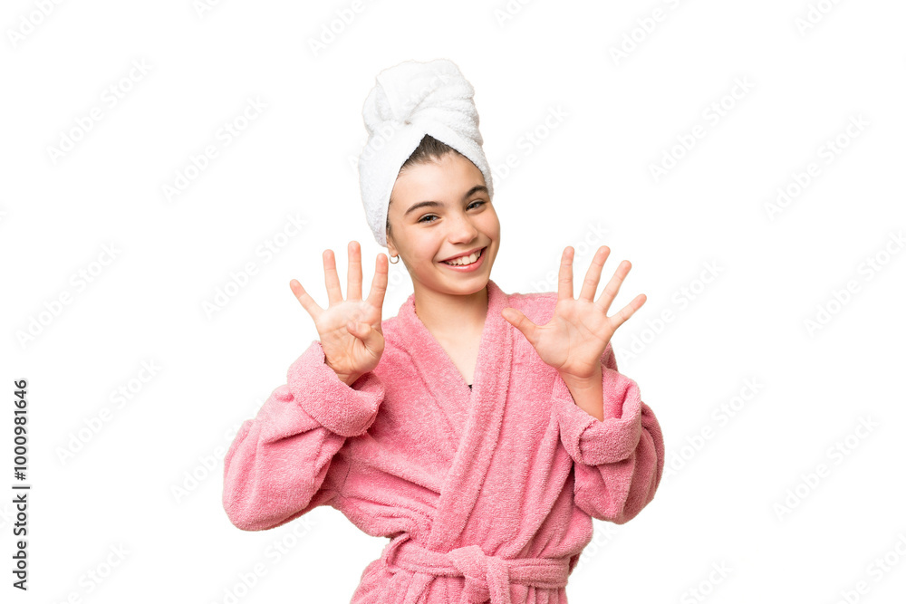 Little girl in a bathrobe over isolated chroma key background counting nine with fingers Little girl in a bathrobe over isolated chroma key background counting nine with fingers