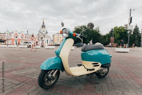 Retro-Style Turquoise and Beige Scooter – Vintage Vibes Photo