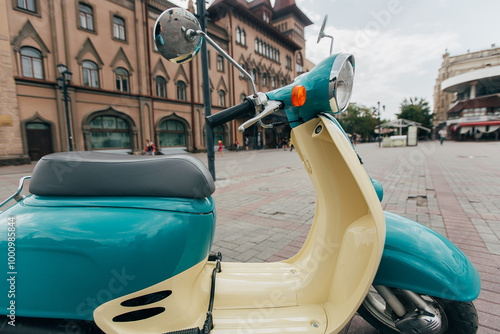 Retro-Style Turquoise and Beige Scooter – Vintage Vibes Photo