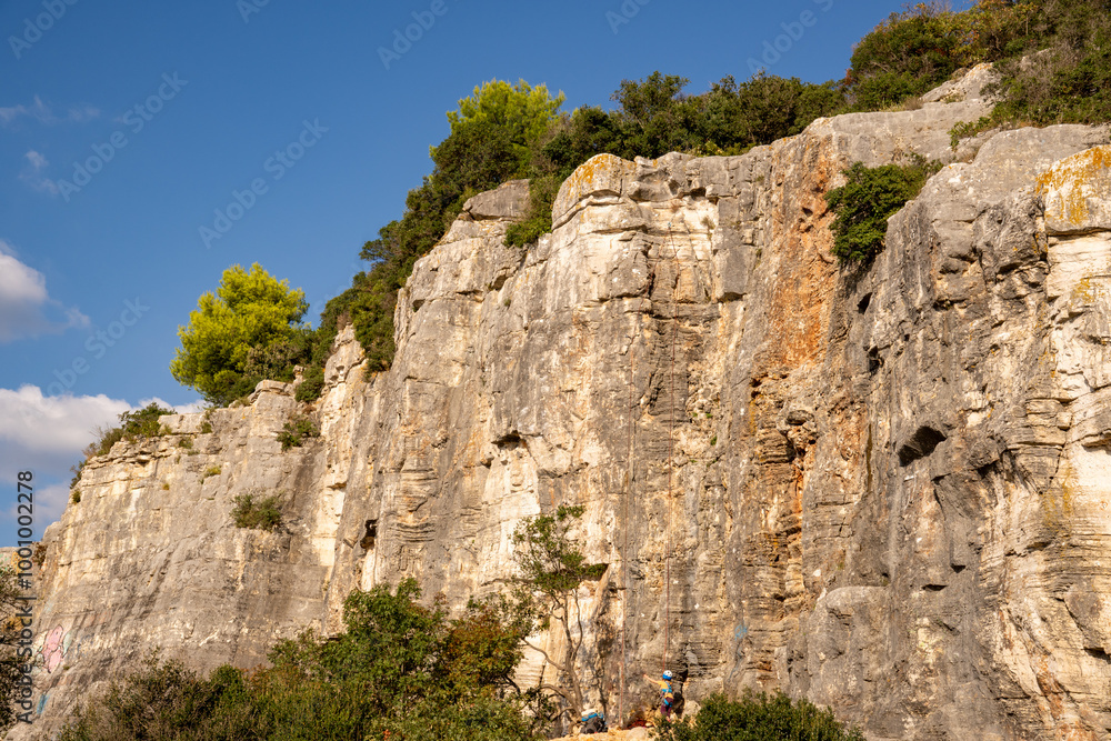Rock climbing - rocks equipped with bolts (sport climbing routes) in the forest park Golden Cape Zlatni rt, Rovinj (Rovigno) - Istria, Croatia