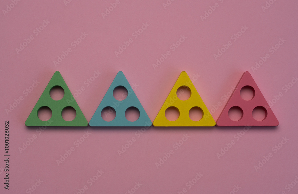 Obraz premium four triangles on a pink background. The concept