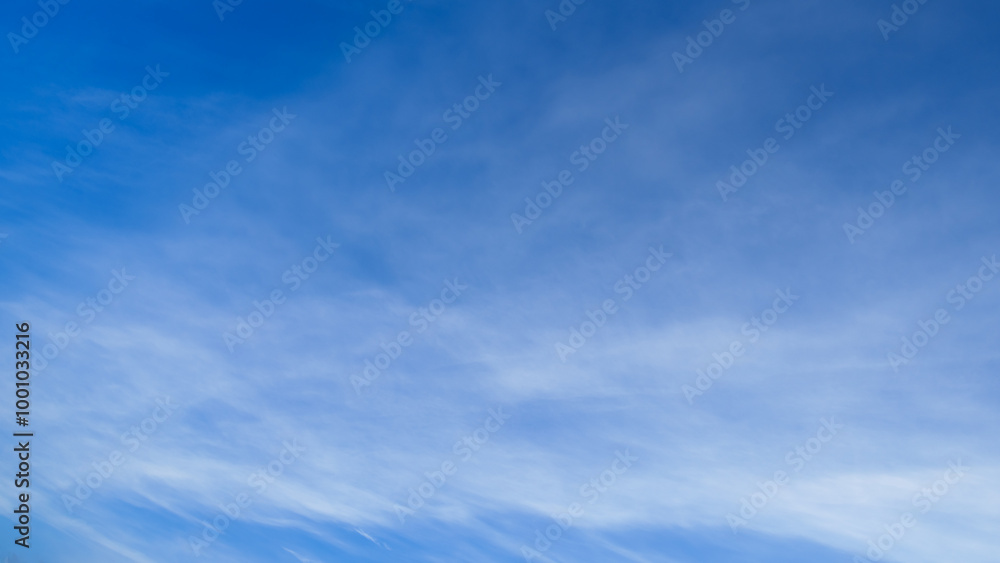 Naklejka premium beautiful blue sky with soft white clouds for abstract background