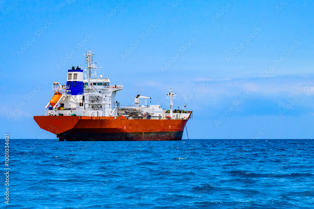 Cargo ship waiting near port of the Stone town. Zanzibar, Tanzania Cargo ship waiting near port of the Stone town. Zanzibar, Tanzania