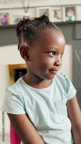 Portrait of an African girl smiling and showing her new hair style