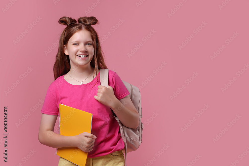 Teenage girl with backpack and notebook on pink background, space for text Teenage girl with backpack and notebook on pink background, space for text