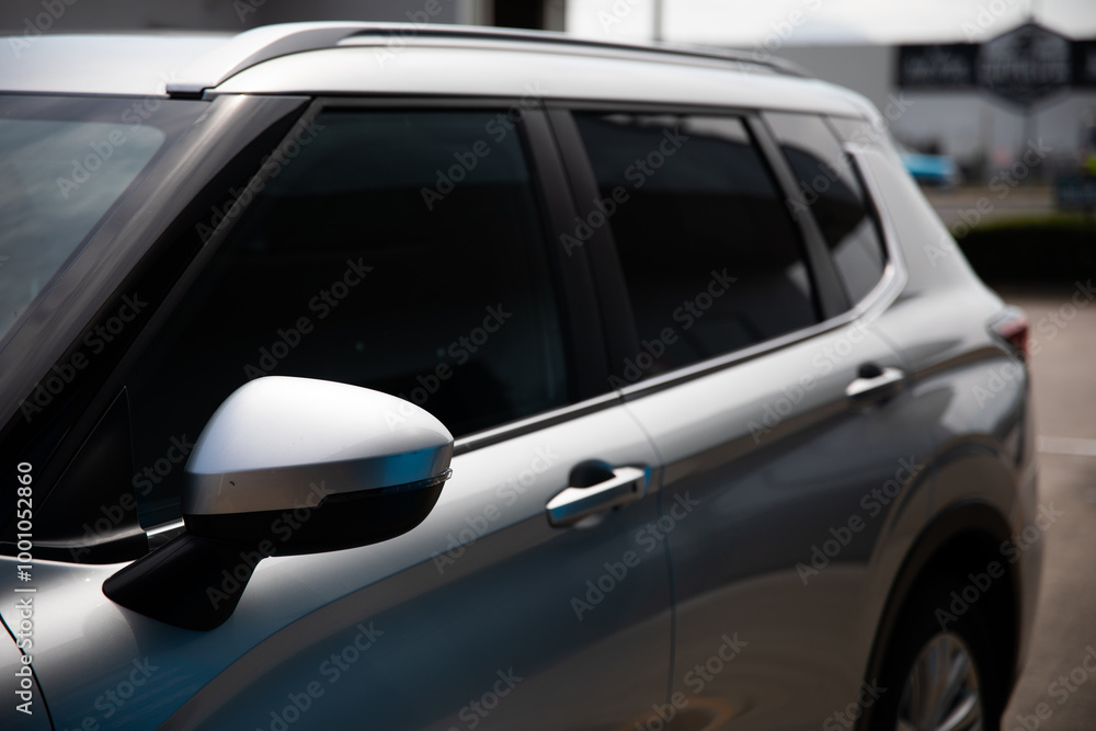 silver car wagon suv parked petrol station tinted windows silver car wagon suv parked petrol station tinted windows
