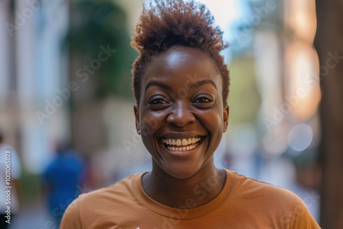 Cheerful individual engaged in outdoor volunteer work for environmental causes, showcasing a commitment to nature and community service while wearing a nonprofit shirt