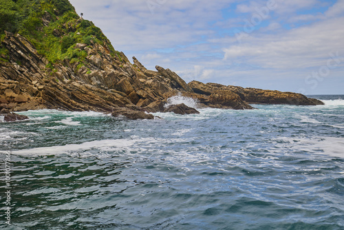 Santa Clara island on background of Monte Igualdo mountain in San Sebastian, Spain photo