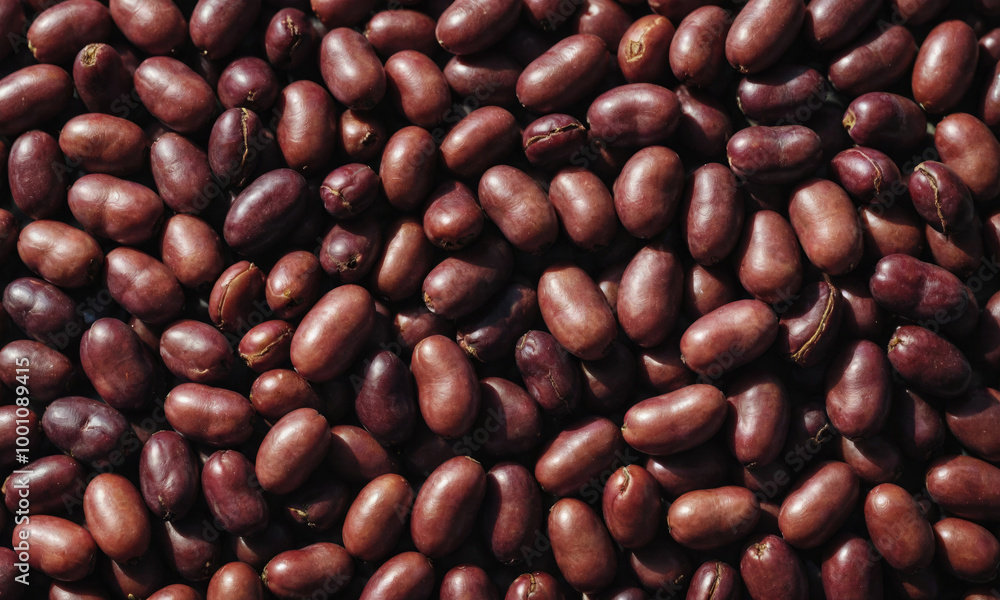 A close-up of roasted coffee beans, ready to be brewed into a delicious cup of coffee A close-up of roasted coffee beans, ready to be brewed into a delicious cup of coffee