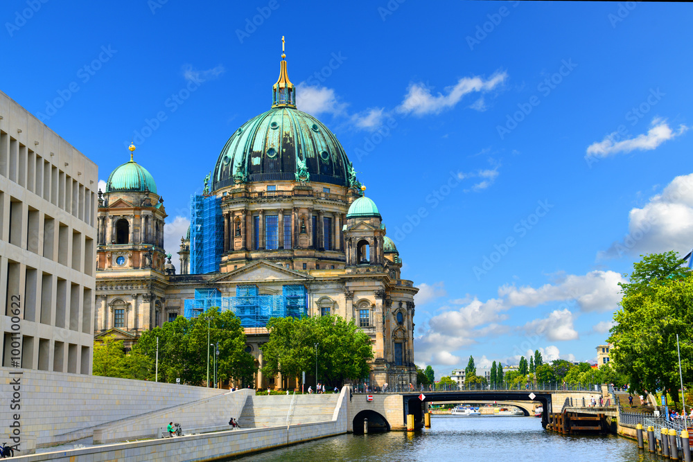 Fototapeta premium Berlin, Germany - July 31st 2024- The photo from a pleasure boat shows Berlin Cathedral on Lustgarten on Museum Island is a Protestant church in Berlin's Mitte district.