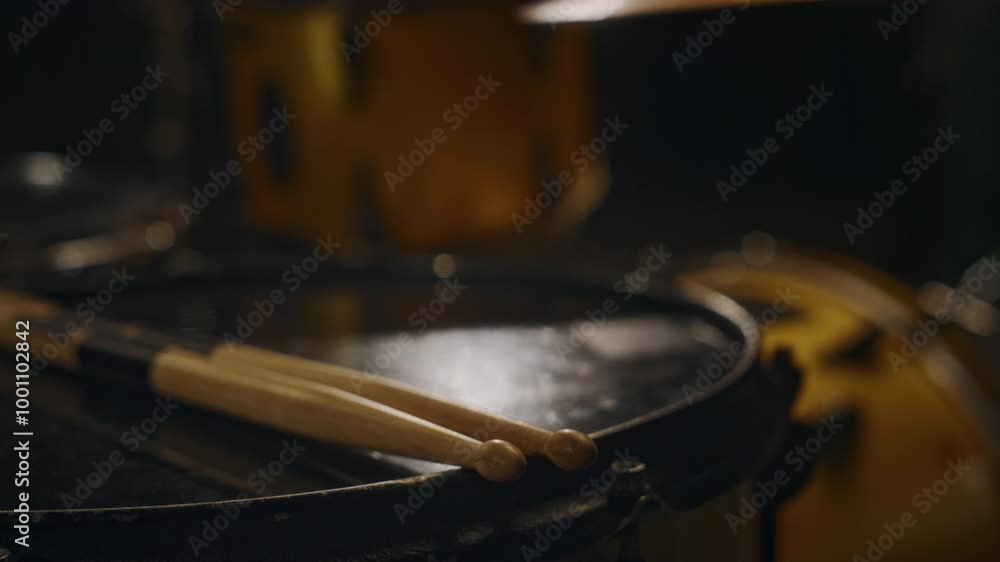 No people close-up of professional drum kit with wooden beaters in music studio prepared for live performance or rehearsal before concert No people close-up of professional drum kit with wooden beaters in music studio prepared for live performance or rehearsal before concert