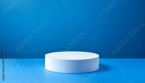 Minimalist White Cylinder Podium on Blue Background