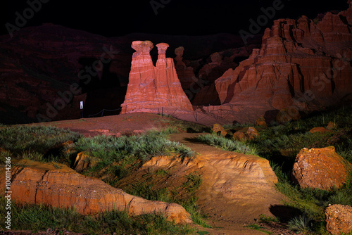 Narman Peri Bacalari or Narman Fairy Chimneys illuminated at night, offering a stunning visual for backgrounds, Erzurum, Turkey photo