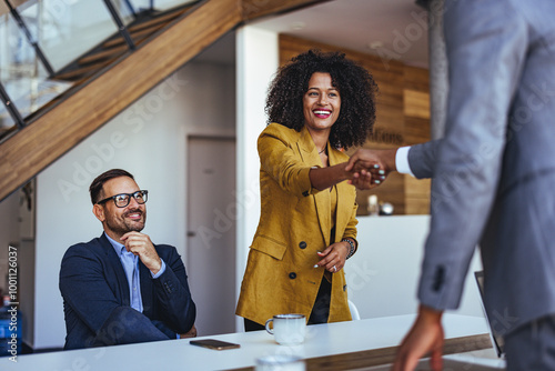 Successful Business Meeting With Handshake in Modern Office