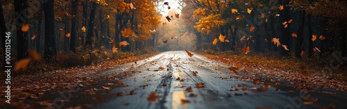 Autumn leaves falling on a serene road lined with vibrant trees