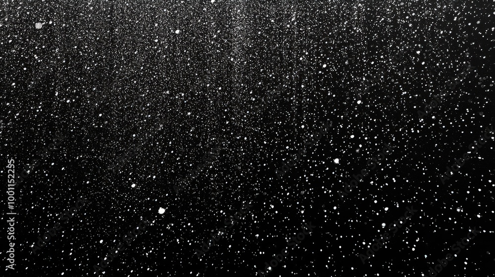 Obraz premium Tiny White Dots in Dense Rain Against Black Background