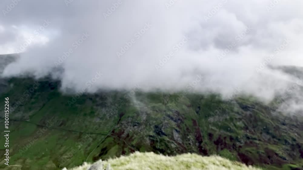 A mist-covered mountain landscape with lush green slopes, creating a mystical and serene atmosphere in the wilderness. A mist-covered mountain landscape with lush green slopes, creating a mystical and serene atmosphere in the wilderness.