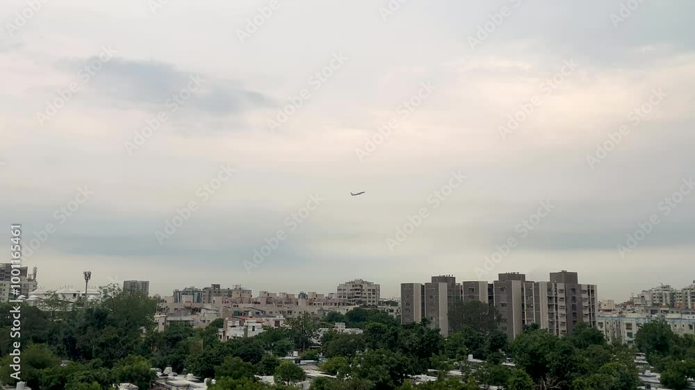 Flight taking off the clouds over the Ahmedabad city in India Flight taking off the clouds over the Ahmedabad city in India