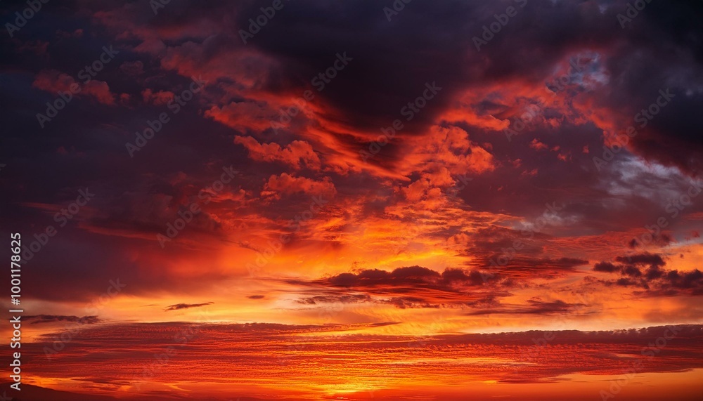 A vivid red sunset paints the evening sky with drama, its fiery hues mingling with billowing clouds. This fantastical backdrop offers space for creative design, evoking themes A vivid red sunset paints the evening sky with drama, its fiery hues mingling with billowing clouds. This fantastical backdrop offers space for creative design, evoking themes