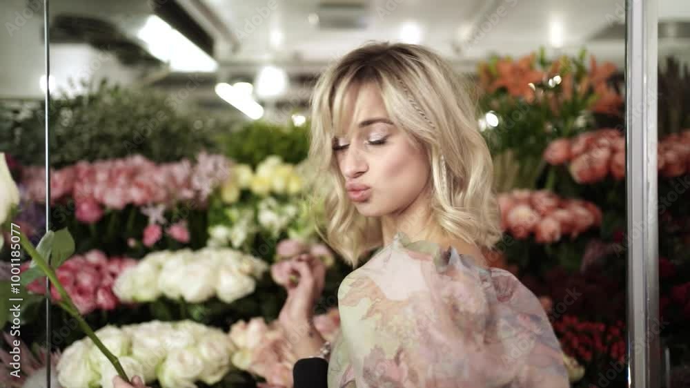 Beautiful Girl Playing with Flowers in Flower Shop Beautiful Girl Playing with Flowers in Flower Shop