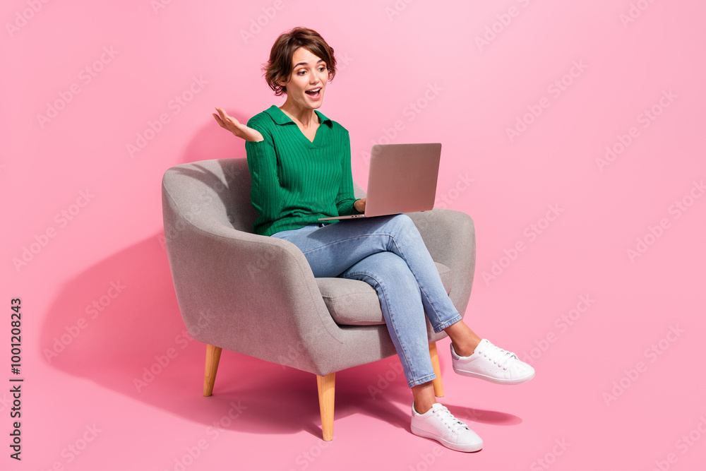 Full body photo of positive woman brown bob hair sit with laptop explaining her project results online isolated on pink color background Full body photo of positive woman brown bob hair sit with laptop explaining her project results online isolated on pink color background