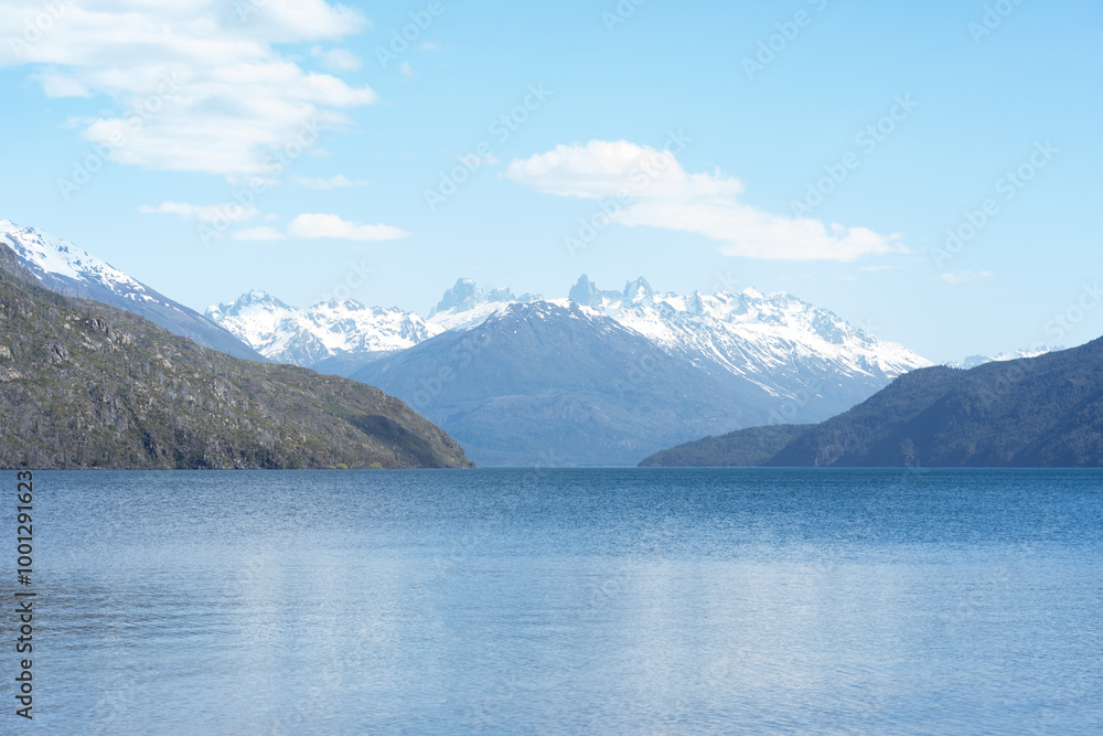 Naklejka premium Beautiful landscape of Puelo Lake -Lago Puelo-National Park during spring with blue glacial lake and snowy mountains in the background. Argentinian Andes, Chubut, Patagonia Argentina.